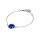
Bracelet with blue rutilated cabochon and zircons