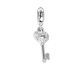 Charm in the shape of a key with zircons