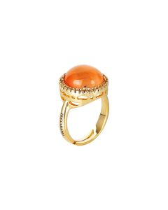 
Ring with flecked orange cabochon crystal and zircons
